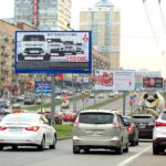 Вернадского  проспект, дом 21, корпус 3, добавочная разделительная полоса ТРИВИЖН    супермаркет «Магнолия», аптека «ГорЗдрав», немецкий  мультимаркет света, колеровочная студия «Dulux», офис МГТС, билборд 6х3, Призмавижн, сторона A